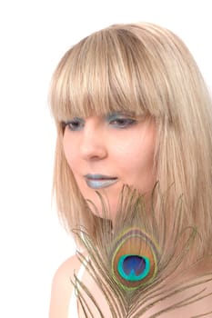 Young woman with peacock feather