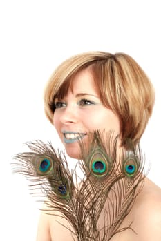 Young woman with peacock feather
