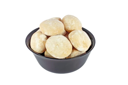 Gingerbreads in black bowl isolated on white