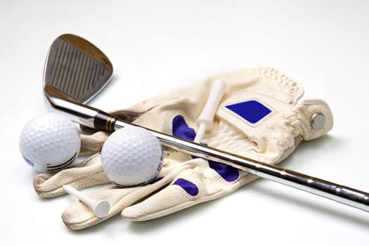 Iron, Ball, Glove and Tee Isolated on White Background