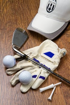 golf equipment on wooden table