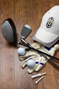 golf equipment on wooden table