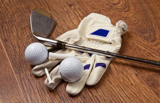 golf equipment on wooden table