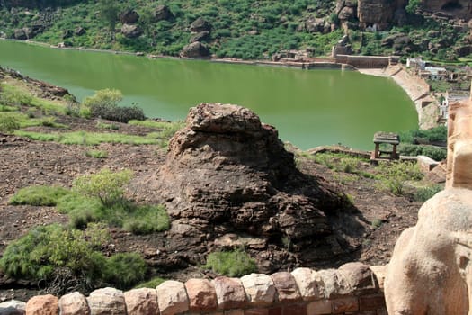 View of rock and Lake Agusthya Teertha from northern hill at Badami, Karnataka, India, Asia