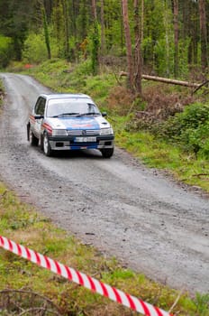 MALLOW, IRELAND - MAY 19: I. Downey driving Opel Corsa at the Jim Walsh Cork Forest Rally on May 19, 2012 in Mallow, Ireland. 4th round of the Valvoline National Forest Rally Championship.