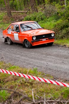 MALLOW, IRELAND - MAY 19: J. Kenneally driving Ford Escort at the Jim Walsh Cork Forest Rally on May 19, 2012 in Mallow, Ireland. 4th round of the Valvoline National Forest Rally Championship.