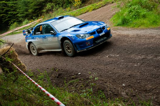 MALLOW, IRELAND - MAY 19: M. Cairns driving Subaru Impreza at the Jim Walsh Cork Forest Rally on May 19, 2012 in Mallow, Ireland. 4th round of the Valvoline National Forest Rally Championship.