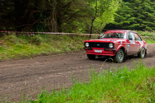MALLOW, IRELAND - MAY 19: A. Commins driving Ford Escort at the Jim Walsh Cork Forest Rally on May 19, 2012 in Mallow, Ireland. 4th round of the Valvoline National Forest Rally Championship.