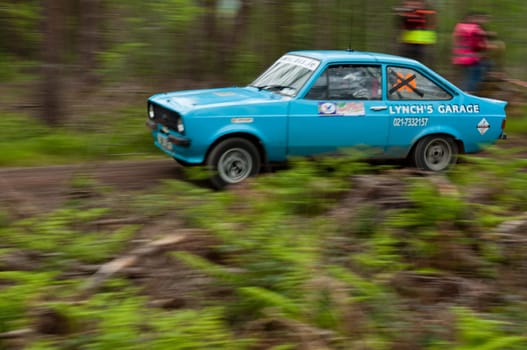 MALLOW, IRELAND - MAY 19: L. Lynch driving Ford Escort at the Jim Walsh Cork Forest Rally on May 19, 2012 in Mallow, Ireland. 4th round of the Valvoline National Forest Rally Championship.