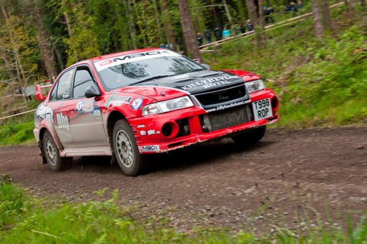 MALLOW, IRELAND - MAY 19: S. Wright driving Mitsubishi Evo at the Jim Walsh Cork Forest Rally on May 19, 2012 in Mallow, Ireland. 4th round of the Valvoline National Forest Rally Championship.