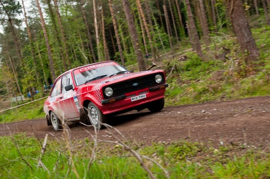 MALLOW, IRELAND - MAY 19: A. Commins driving Ford Escort at the Jim Walsh Cork Forest Rally on May 19, 2012 in Mallow, Ireland. 4th round of the Valvoline National Forest Rally Championship.