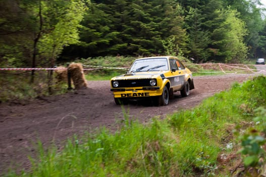 MALLOW, IRELAND - MAY 19: J. Deane driving Ford Escort at the Jim Walsh Cork Forest Rally on May 19, 2012 in Mallow, Ireland. 4th round of the Valvoline National Forest Rally Championship.