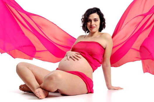 Beautiful pregnant woman with pink scarf