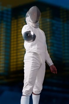 Male fencer isolated in a dark background