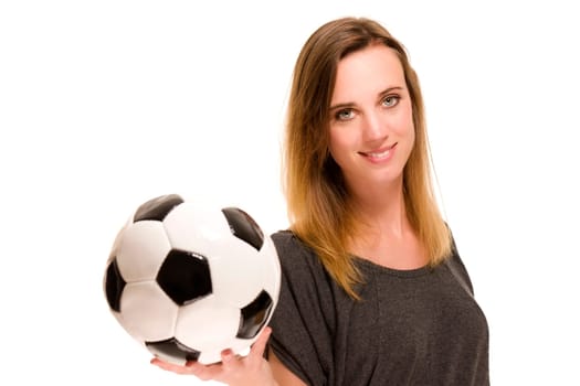 Woman holding soccer ball against white background