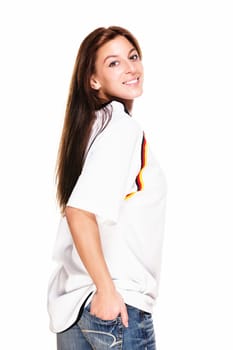 Young woman in soccer jersey turns around against white background