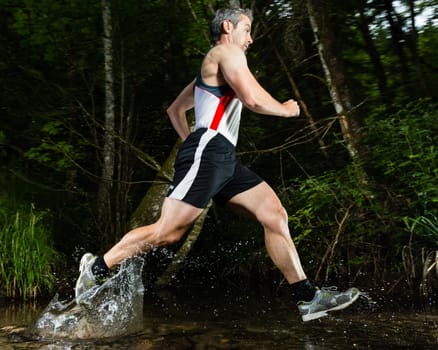 Jogger crosses creek bed