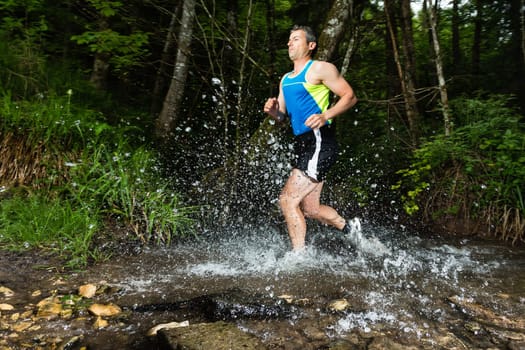Jogger crosses creek bed