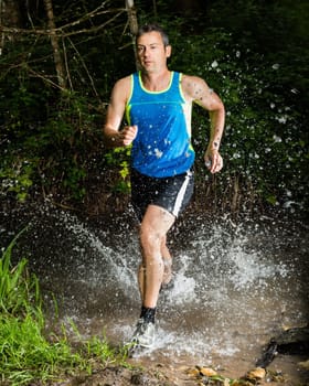 Jogger crosses creek bed