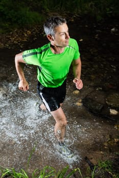 Jogger crosses creek bed