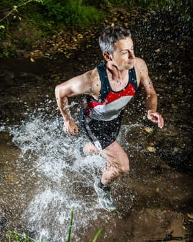 Jogger crosses creek bed