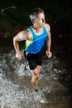 Jogger crosses creek bed