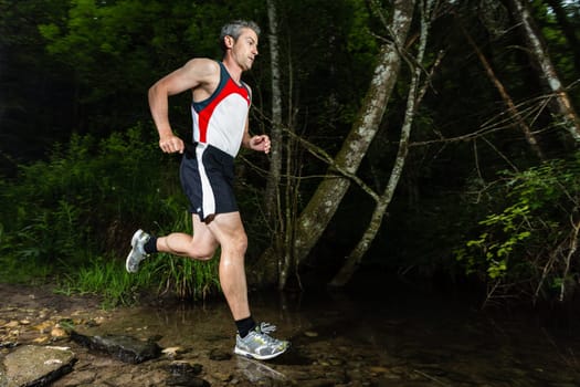 Jogger crosses creek bed