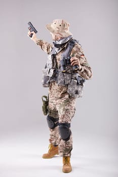 Commander with a handgun and binoculars over white background
