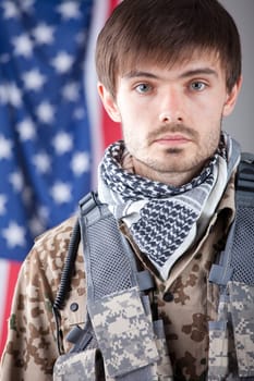Portrait of tired soldier over american flag