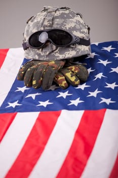 Military funeral - helmet and gloves on the american flag