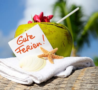 Coconut cocktail starfish tropical Caribbean beach refreshment and towel