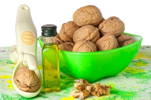 nuts in the green container and Nutcracker
