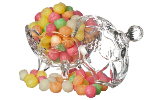 colored candy in a container of crystal on a white background
