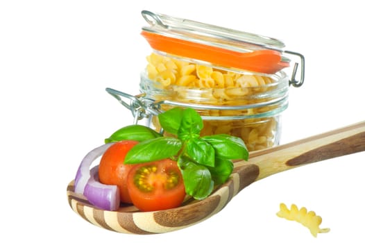 Italian pasta and ingredients for dressing on a white background