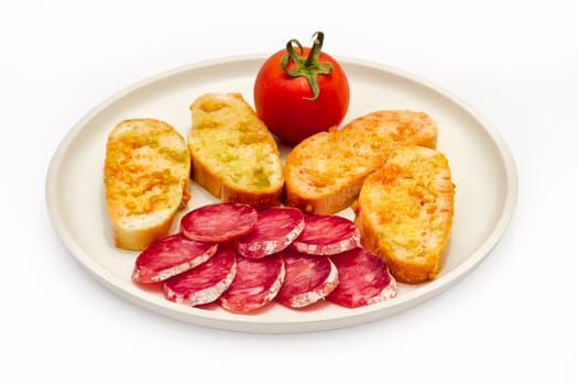 Catalan-style tomato rubbed on a slice of bread with oil and salt point, about the scourge of rural style.