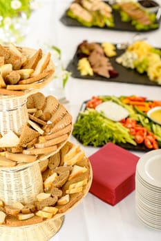 Bread selection catering buffet served food on white tablecloth