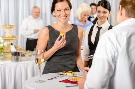 Business woman eat dessert from catering service during company meeting