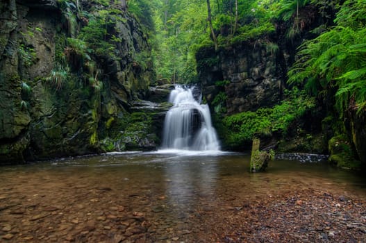 Shot of the fall of water. Stream Huntava - natural area - nature preserve. Resov, Czech republic, Europe.