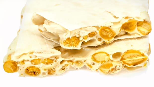 Nougat with almonds on the white