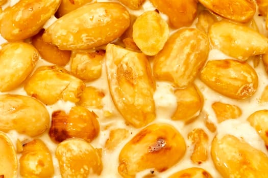 Nougat with almonds on the white