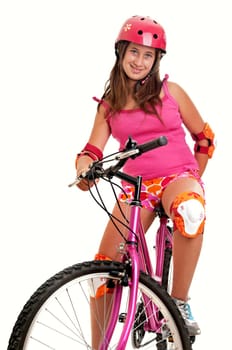 Beautiful young girl with a bicycle isolated in white