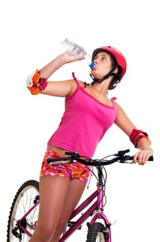 Beautiful young girl with a bicycle isolated in white
