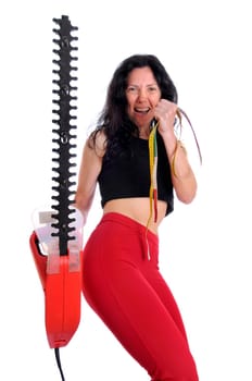 Mature fit woman with measuring tape and saw isolated in white