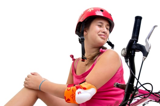 Beautiful young girl in a bicycle crash isolated in white