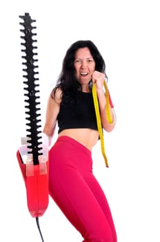 Mature fit woman with measuring tape and saw isolated in white