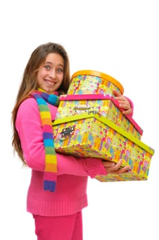 Beautiful young girl with present boxes isolated in white