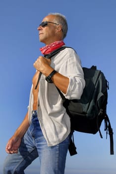 Mature man adventurer posing outdoors
