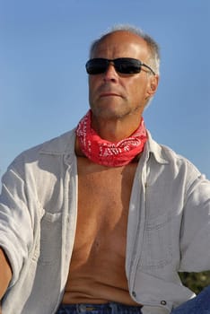 Handsome mature model posing outdoors