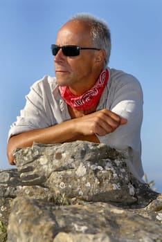 Handsome mature man model posing otdoors