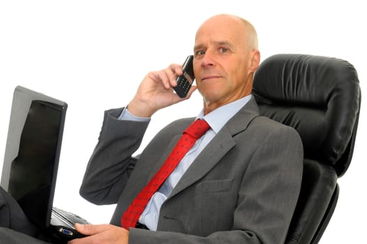 Mature man with cellphone and laptop isolated in white